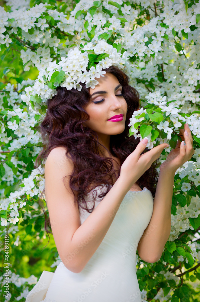 Bride on the background of blooming apple trees Bride on the background of blooming apple trees