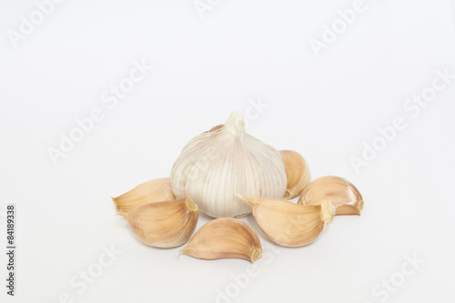 Bulbs of garlics on white background.