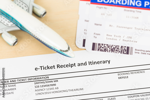 E-ticket with plane model, and boarding pass; these documents ar