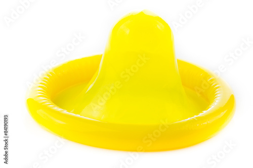 yellow condom on white background