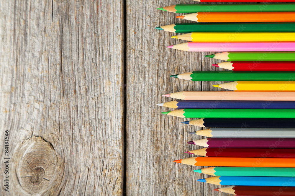 Obraz premium Colour pencils on grey wooden background