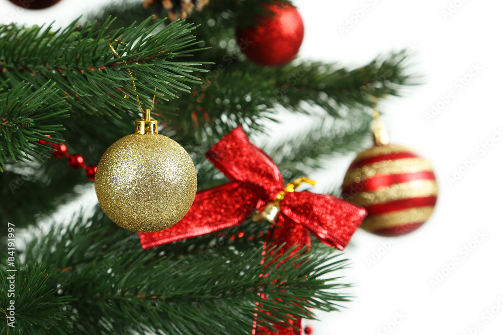 Christmas baubles on christmas tree on white background Christmas baubles on christmas tree on white background
