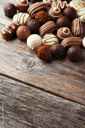 Chocolates on grey wooden background