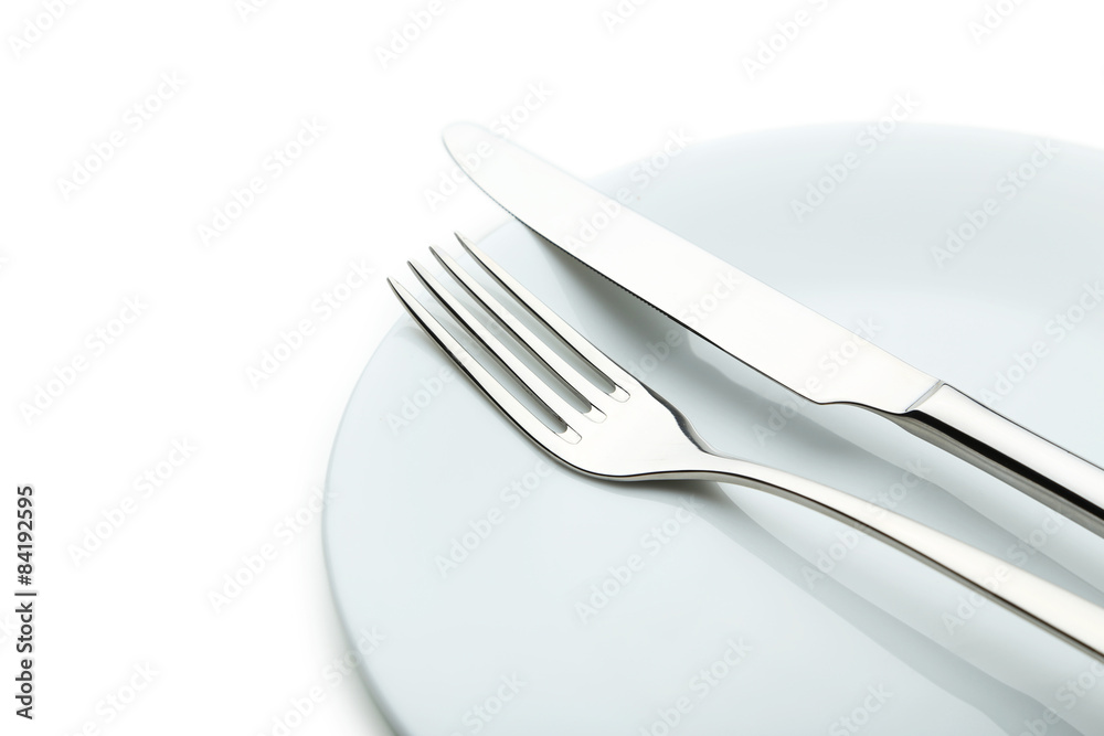 Fork, knife and plate on white background Fork, knife and plate on white background