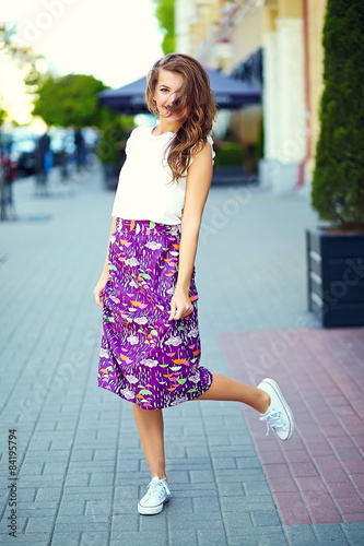 Funny stylish model girl in summer hipster cloth in the street