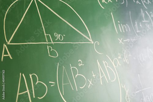 Mathematics formulas on blackboard background