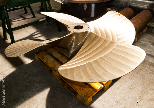 Photos Heavy industrial shipbuilding element in workshop.