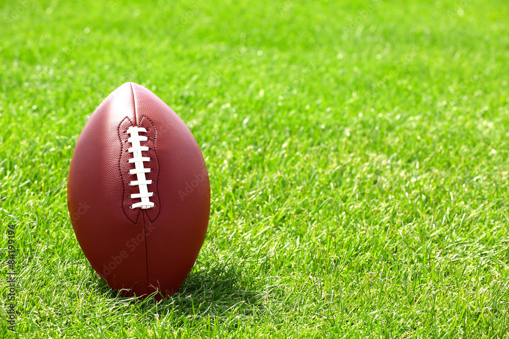 Rugby ball on green field