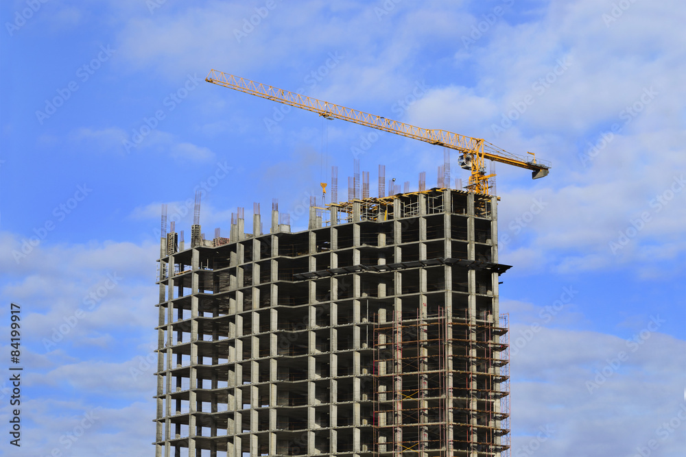 High-rise building under construction and crane High-rise building under construction and crane