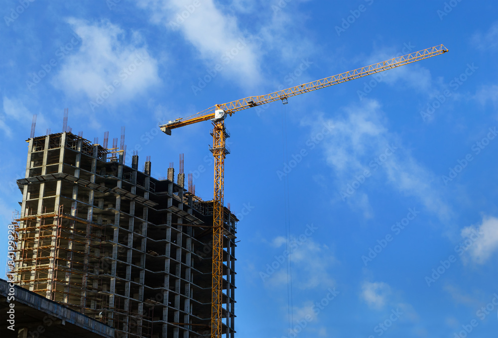High-rise building under construction and crane High-rise building under construction and crane