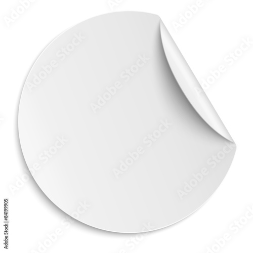 Round paper sticker isolated on white. Light from upper right.