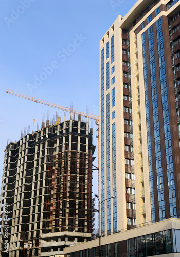 High-rise building under construction and crane