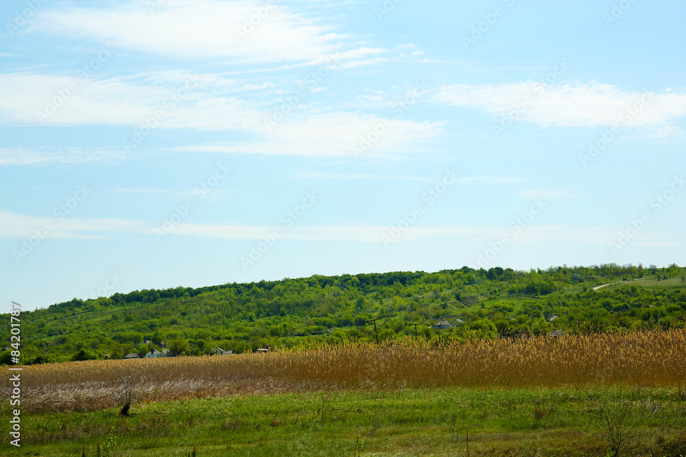 Beautiful view of countryside over blue sky background