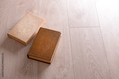 Old books on wooden background