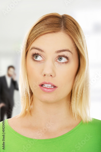 Young woman looking up.