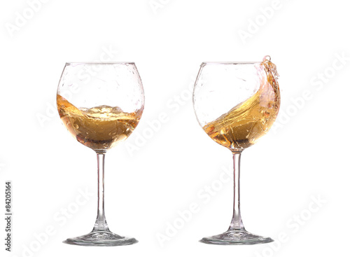 white wine splash before white background photo