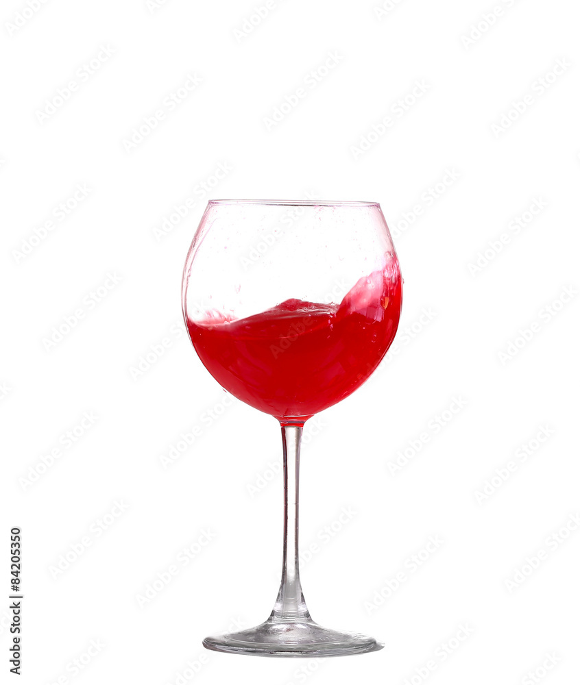 red wine splashing in a glass, isolated on white red wine splashing in a glass, isolated on white