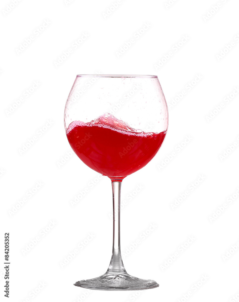 red wine splashing in a glass, isolated on white red wine splashing in a glass, isolated on white