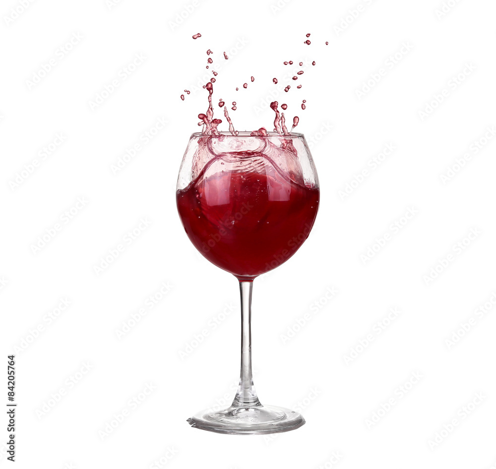 red wine pouring into wine glass isolated on a white background red wine pouring into wine glass isolated on a white background