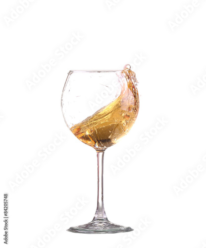white wine splash before white background photo
