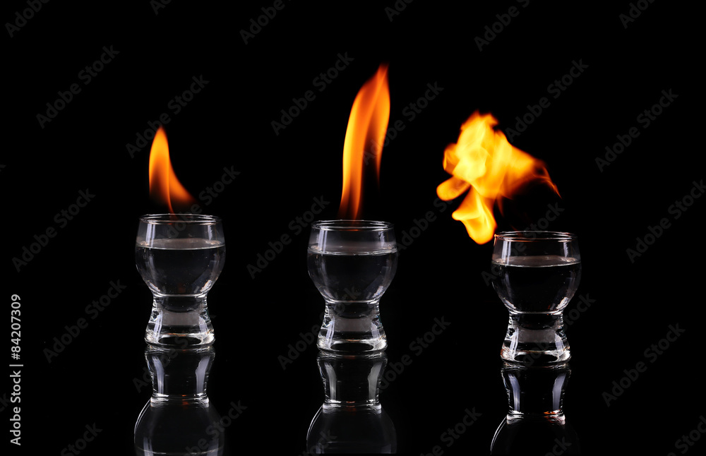 collage Glass of tequila and flames collage Glass of tequila and flames