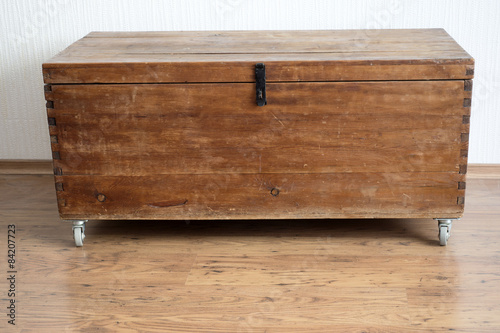 simple vintage wooden chest in clean room environment
