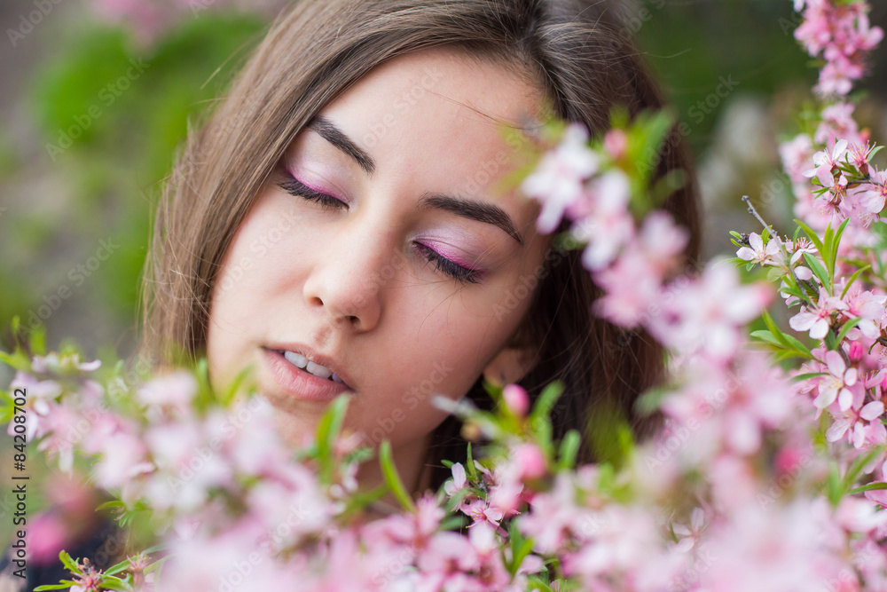 portrait of young beautiful girl in flowers portrait of young beautiful girl in flowers