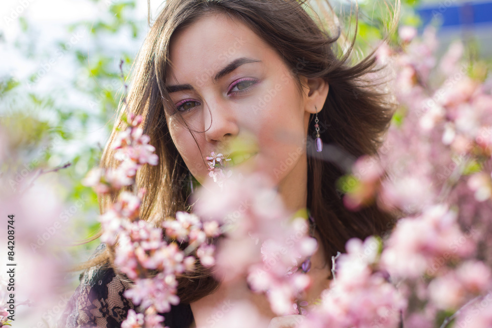 portrait of young beautiful girl in flowers portrait of young beautiful girl in flowers