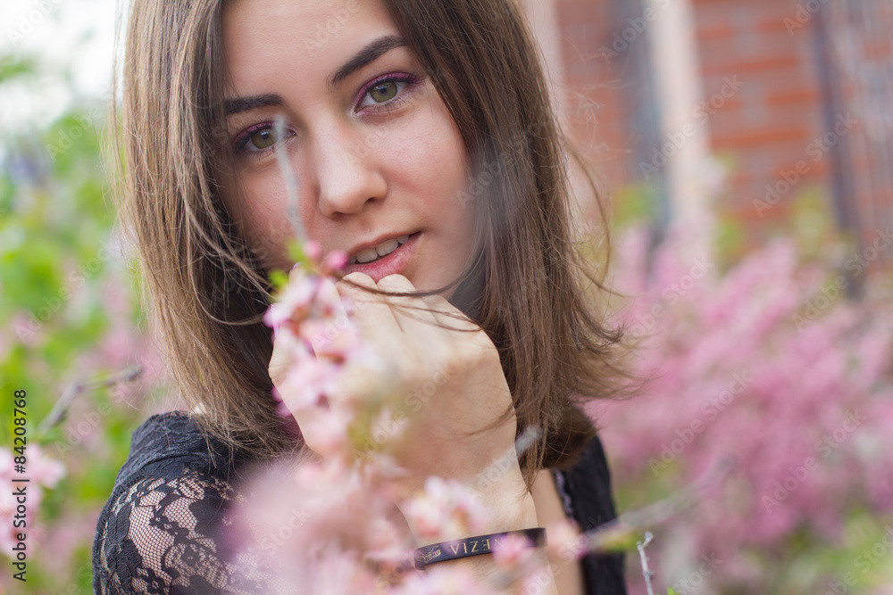 portrait of young beautiful girl in flowers portrait of young beautiful girl in flowers