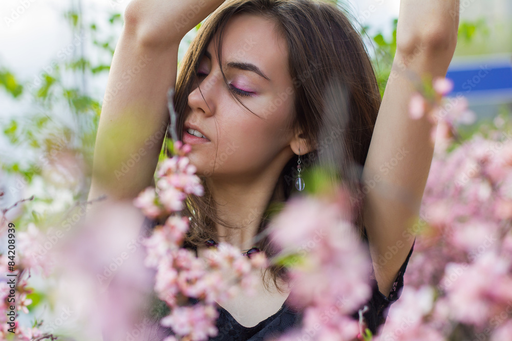 portrait of young beautiful girl in flowers portrait of young beautiful girl in flowers