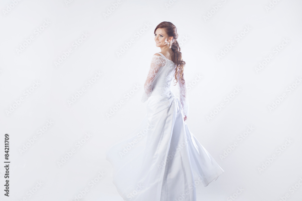 Beautiful bride in wedding dress, white background