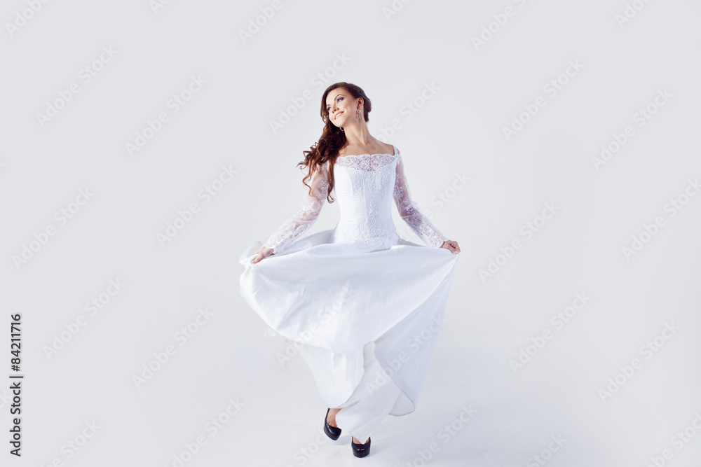 Beautiful bride in wedding dress, white background Beautiful bride in wedding dress, white background
