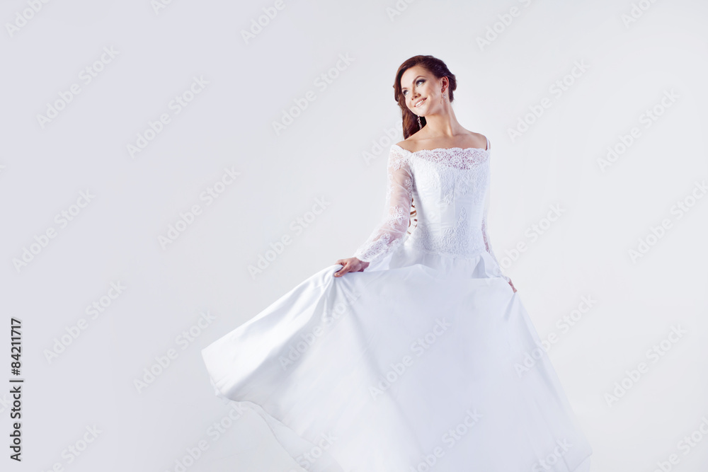 Beautiful bride in wedding dress, white background Beautiful bride in wedding dress, white background
