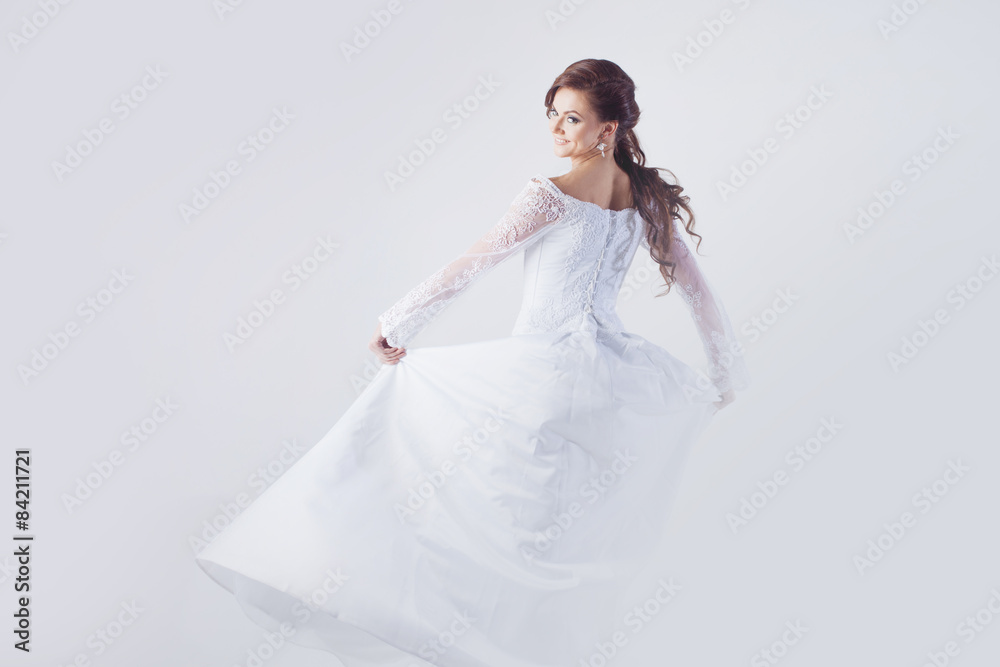 Beautiful bride in wedding dress, white background Beautiful bride in wedding dress, white background