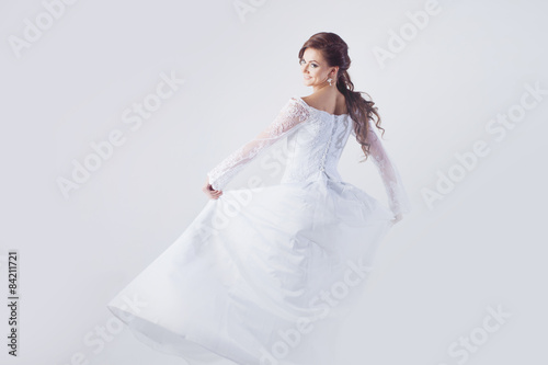 Beautiful bride in wedding dress  white background