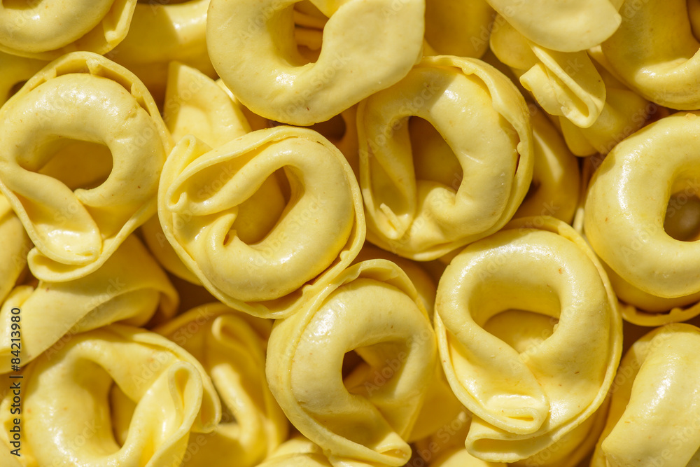 Dried tortellini background close-up Dried tortellini background close-up