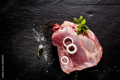 Картината върху платно Raw Venison Roast Seasoned with Herbs and Spices