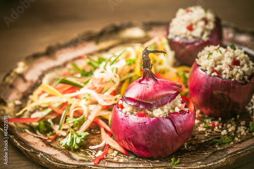 Delicious spicy couscous stuffing in an onion