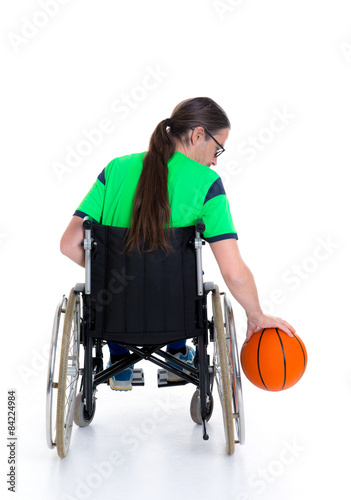 disabled man in a wheelchair is doing sport with ball