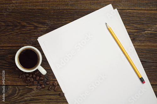 Sheet of white paper and coffee
