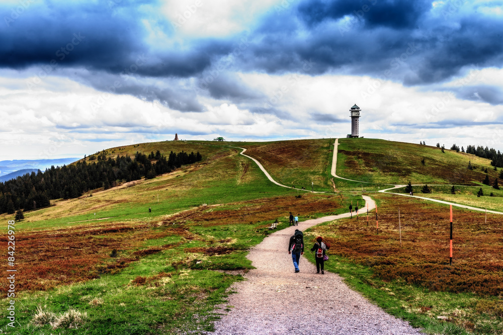Obraz premium People Hiking at Feldberg Mountain in Spring