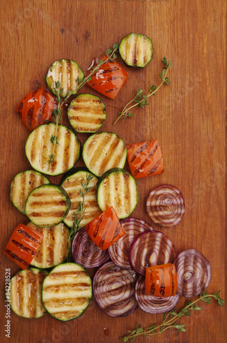 Grilled vegetables on cutting board.