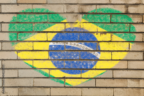 heart shape flag of Brazil on brick wall