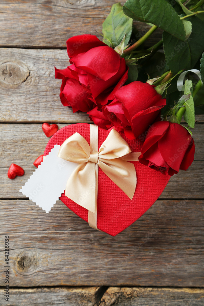 Beautiful heart gift box on grey wooden background Beautiful heart gift box on grey wooden background