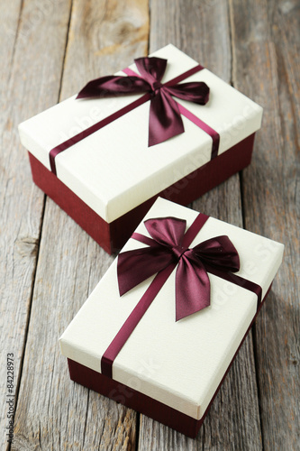 Beautiful gift boxes on grey wooden background
