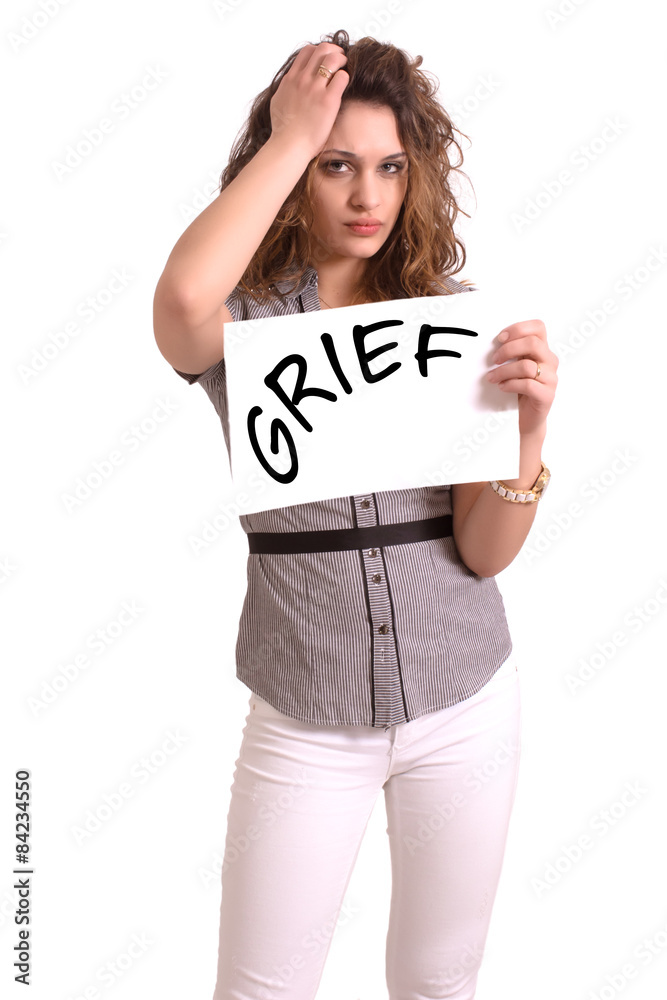 uncomfortable woman holding paper with Grief text uncomfortable woman holding paper with Grief text