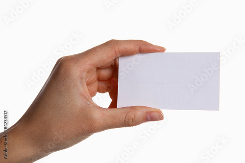 Female hand holding a blank business card