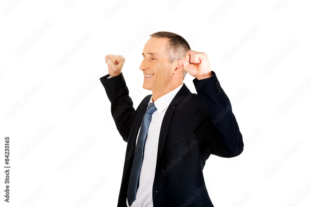 Portrait of successful businessman with arms up Portrait of successful businessman with arms up