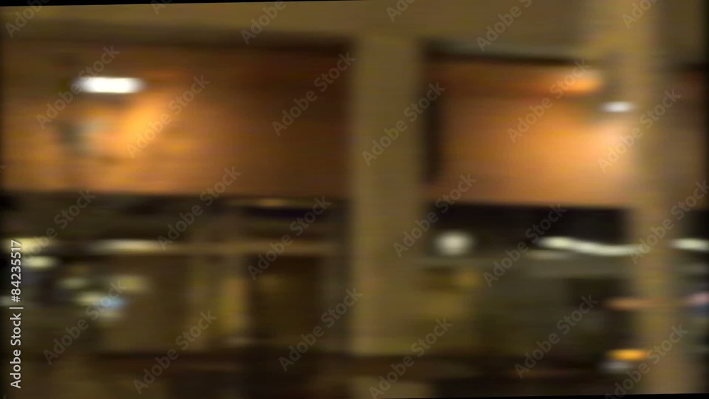 Blur of buildings sliding by as seen through car window

