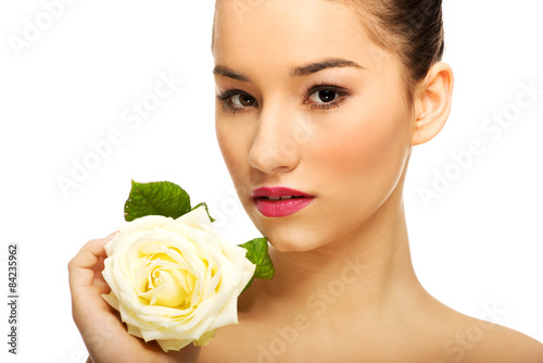 Beautiful woman with white rose.